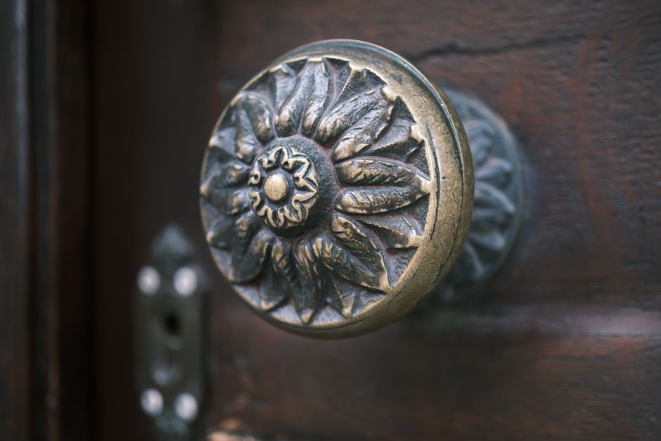 Close up of brass door knob on a replaced front door